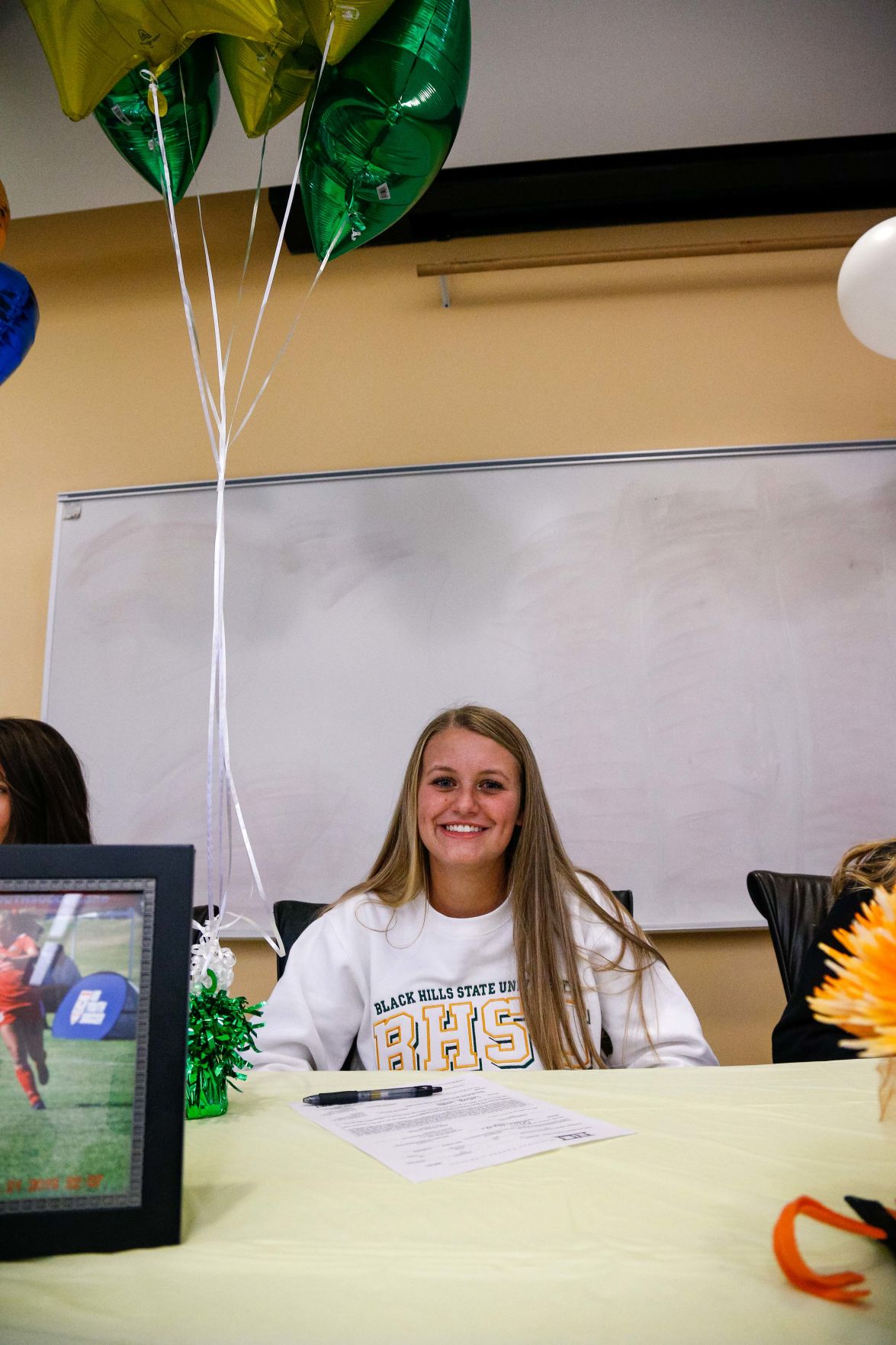 SIGNING DAY: Rampart athletes sign their National Letter of Intent